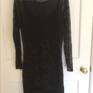 Sheer little black dress with underslip